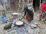 Woman making injera, Amo, Ethiopia