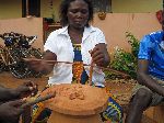 Ghana, bauxite bead making, drilling hole