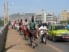 bicyclists and other traffic on the bridge in Bamako Mali