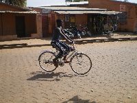 Natitingou, Benin, street scene, bicyclist