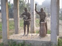 near Lokossa, Benin, statue of drummers
