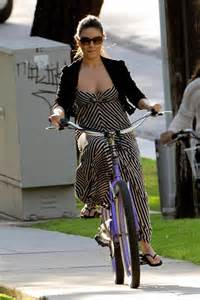 Mila Kunis bicycling