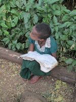 Girl reading at Beta Maryam Monastery, Ethiopia