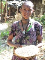 Girl selling souvenir, Woleka (Fellasha village), Ethiopia