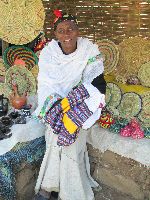 Woman selling weaving, Woleka (Fellasha village), Ethiopia