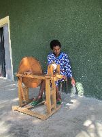 Spinning thread, Plowshares Women's Craft Training Center, Woleka, Ethiopia