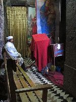 Priest, Interior, Bet Maryam (rock hewn church), Lalibela, Ethiopia