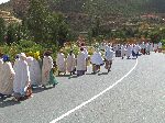 Mourners dressed in white in funeral procession, Ethiopia