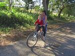 Mother and child bicycliing, Cuba