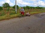 bicyclist with goods in a bicycle trailer, Cuba