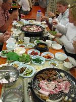 Table spread with food at Korean dinner meal