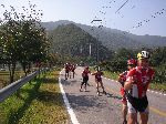 Roller blading group glides down a rural road, Korea.