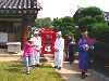 Korean bride being carried in to tradition wedding ceremony
