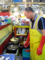 Cooking a fish, Sindonga Fish Market