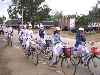 High school girls bicycling from school