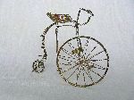 Plated wire and rubber penny farthing bicycle sculpture from Harare, Zimbabwe